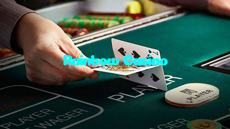Rainbow Casino casino presented on mobile device in Pakistan with slots and live games